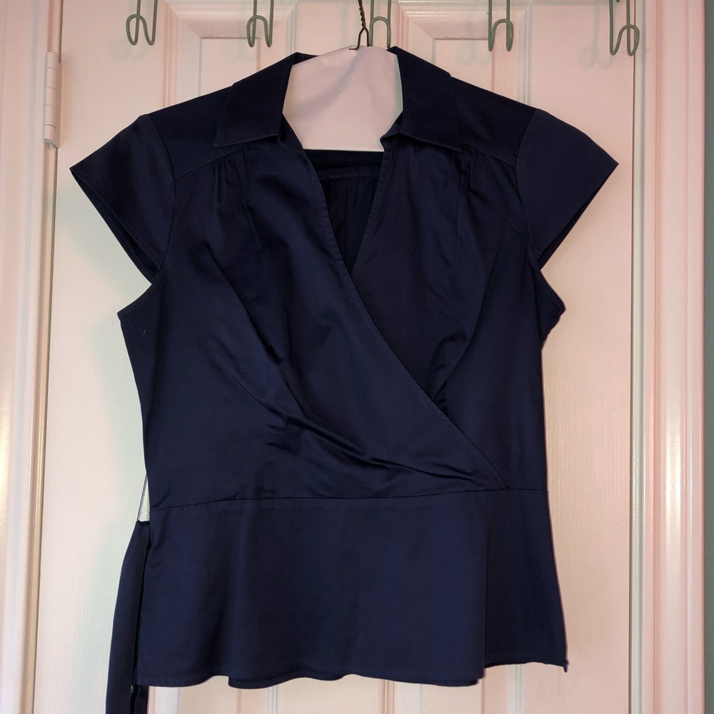 Blue collared blouse with a belt